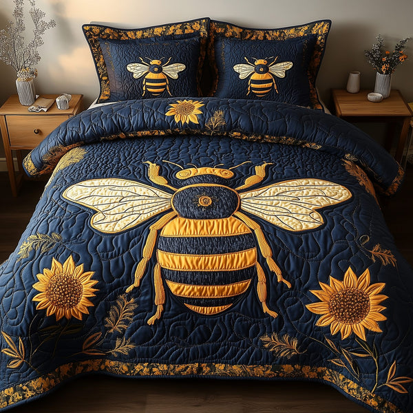 Bee Positive quilted 3-piece bedding set on a made bed with two matching pillow shams