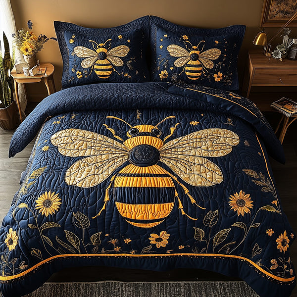 Bee Positive quilted 3-piece bedding set on a made bed with two matching pillow shams