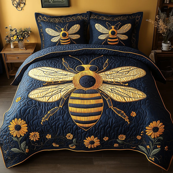 Bee Positive quilted 3-piece bedding set on a made bed with two matching pillow shams