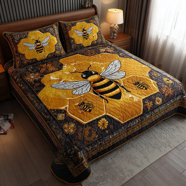 Bee Whisper quilted 3-piece bedding set on a made bed with two matching pillow shams