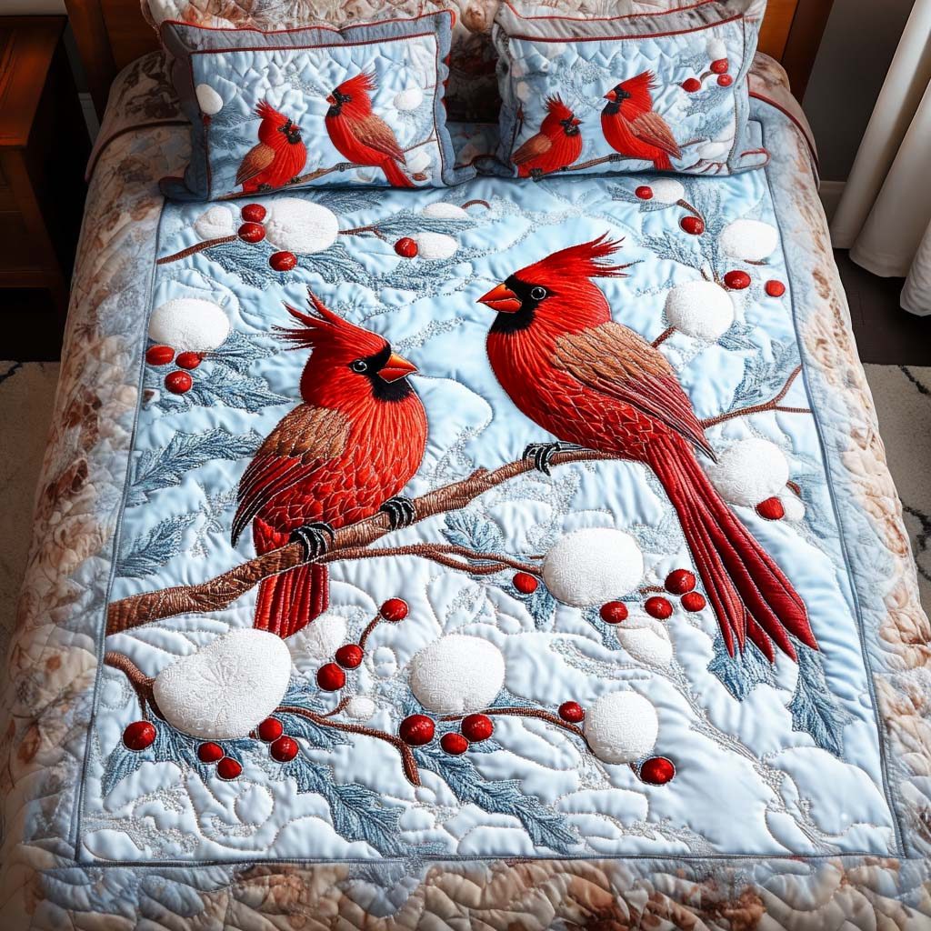 Berry Songbirds quilted 3-piece bedding set on a made bed with two matching pillow shams