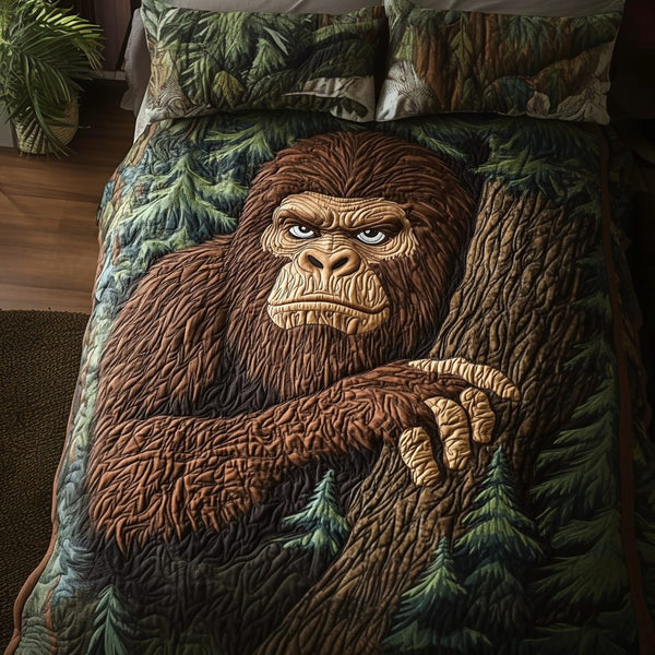 Bigfoot Forest quilted 3-piece bedding set on a made bed with two matching pillow shams