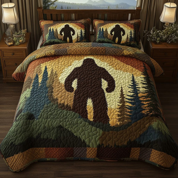 Bigfoot Forest Silhouette quilted 3-piece bedding set on a made bed with two matching pillow shams