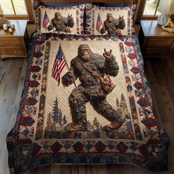 Bigfoot Independence quilted 3-piece bedding set on a made bed in a warmly lit bedroom