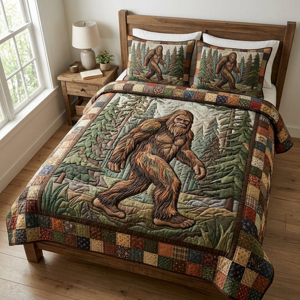 Bigfoot Quest quilted 3-piece bedding set on a made bed with two matching pillow shams