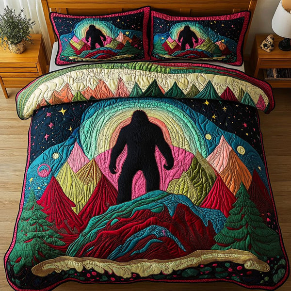 Bigfoot Spirit quilted 3-piece bedding set on a made bed with two matching pillow shams