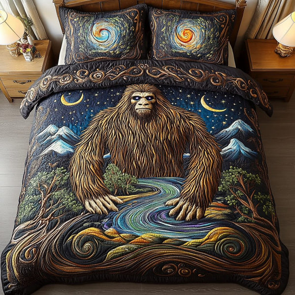 Bigfoot Trails quilted 3-piece bedding set on a made bed with two matching pillow shams