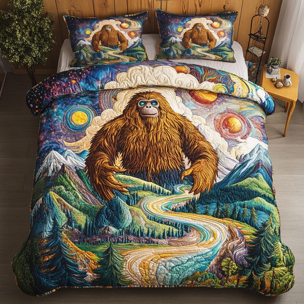 Bigfoot Wanderer quilted 3-piece bedding set on a made bed with two matching pillow shams