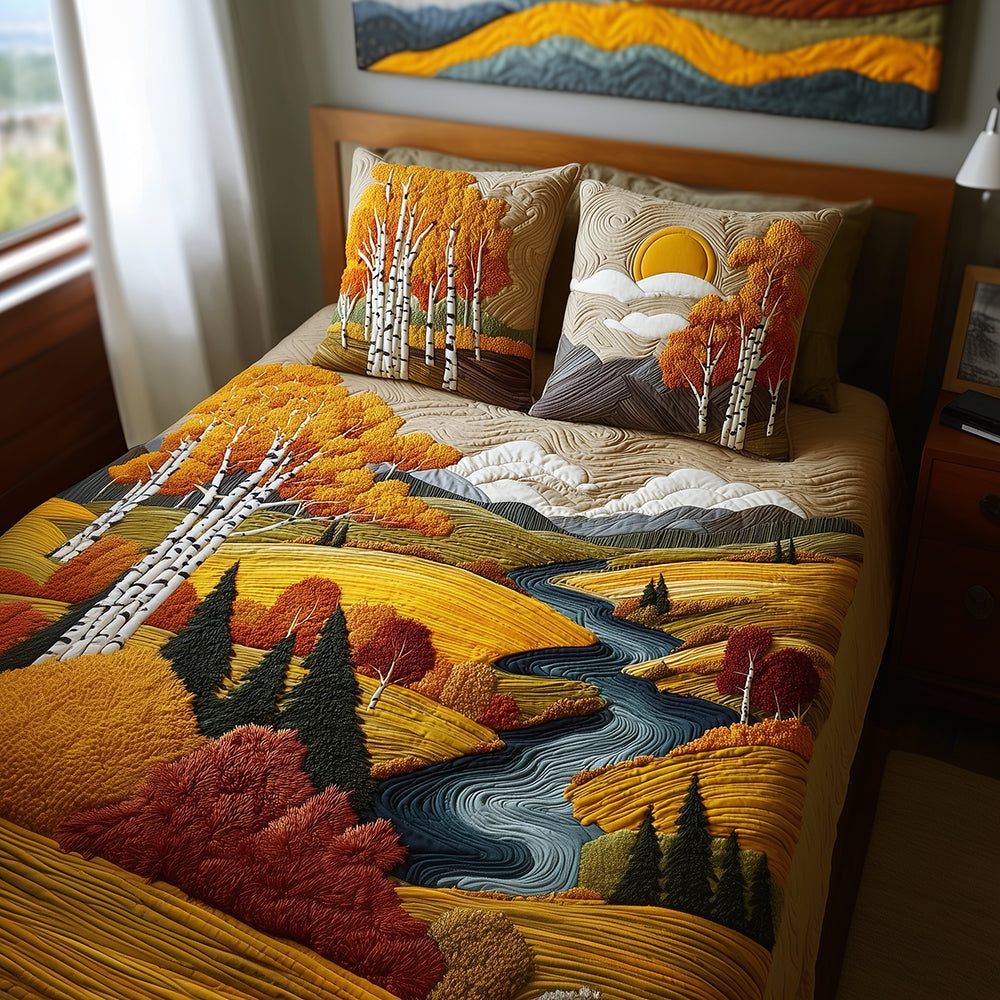 Birch Sunset Glow quilted 3-piece bedding set on a made bed with two matching pillow shams