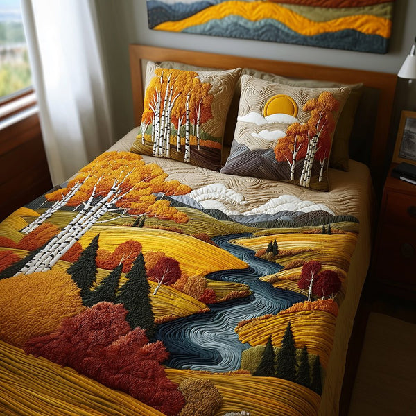 Birch Sunset Glow quilted 3-piece bedding set on a made bed with two matching pillow shams