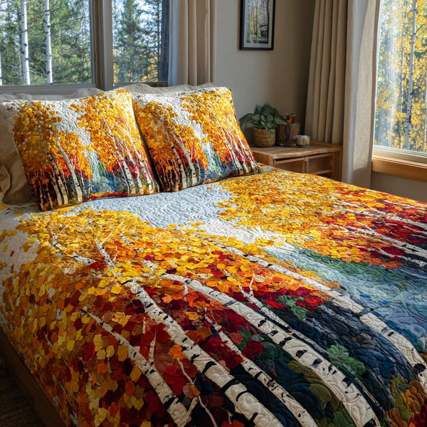 Birchwood Glow quilted 3-piece bedding set on a made bed with two matching pillow shams