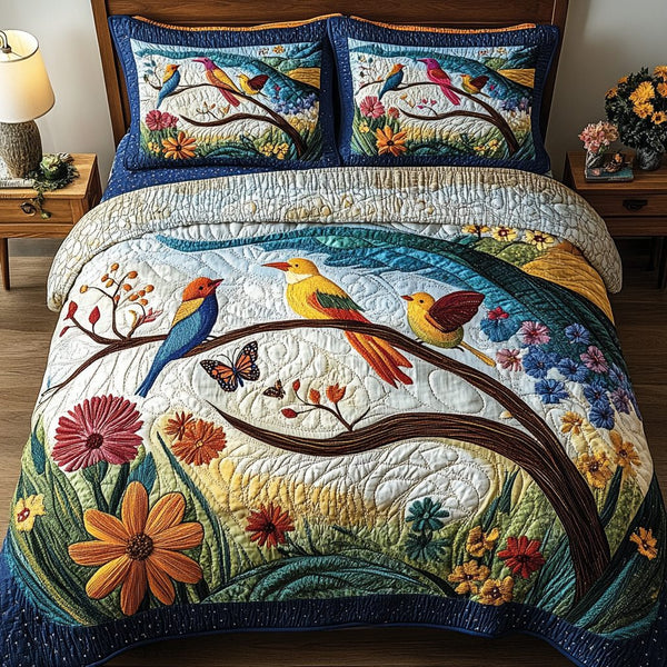 Birds Delight quilted 3-piece bedding set on a made bed with two matching pillow shams
