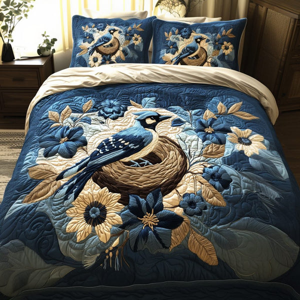 Birdsong Beauty quilted 3-piece bedding set on a made bed with two matching pillow shams