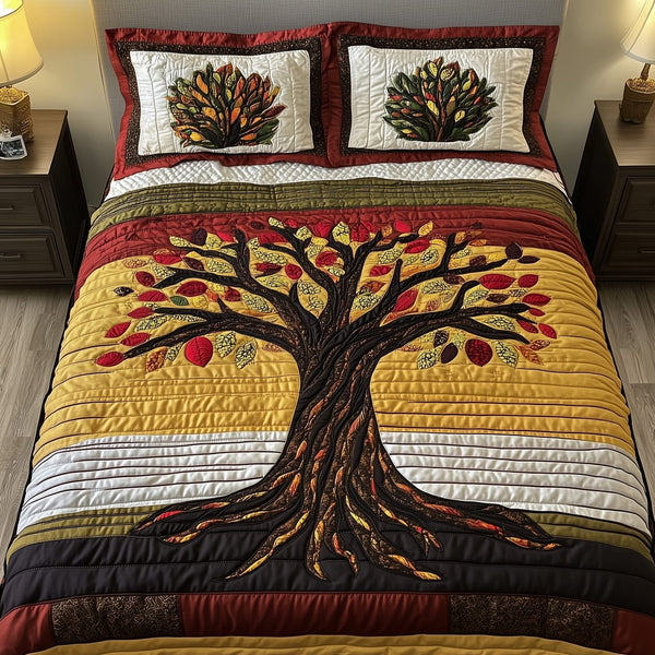 Black History Tree quilted 3-piece bedding set on a made bed with two matching pillow shams