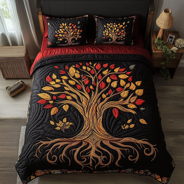 Black History Tree quilted 3-piece bedding set on a made bed with two matching pillow shams