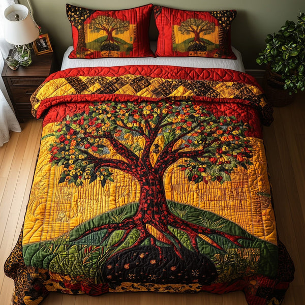 Black History Tree quilted 3-piece bedding set on a made bed with two matching pillow shams