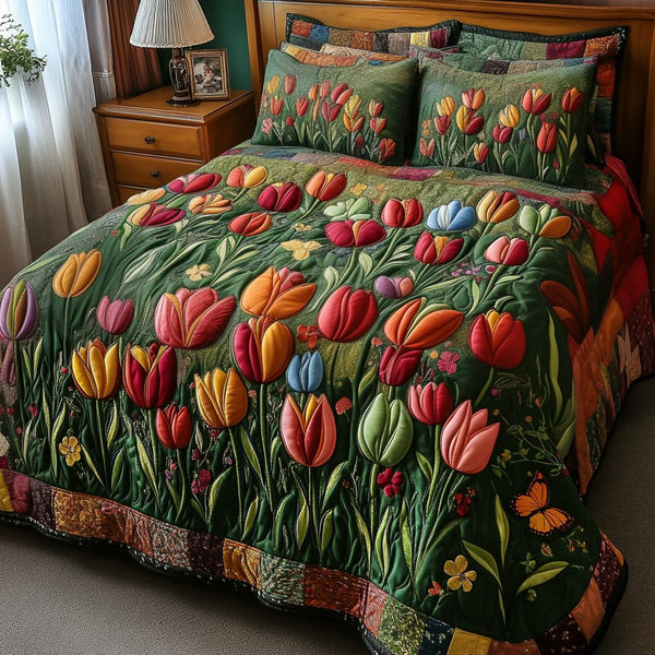 Bloom Bliss quilted 3-piece bedding set on a made bed with two matching pillow shams