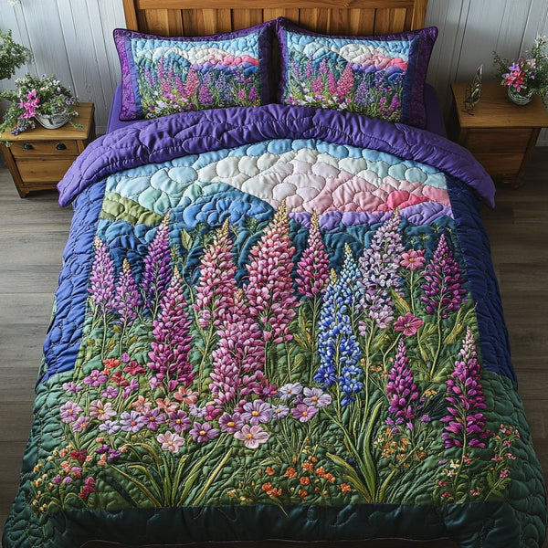 Bloom Bliss quilted 3-piece bedding set on a made bed with two matching pillow shams