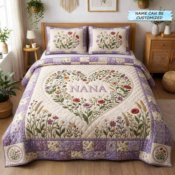 Bloom for Mom 3-Piece Quilted Bedding Set QTCUZ quilted 3-piece bedding set on a made bed with two matching pillow shams
