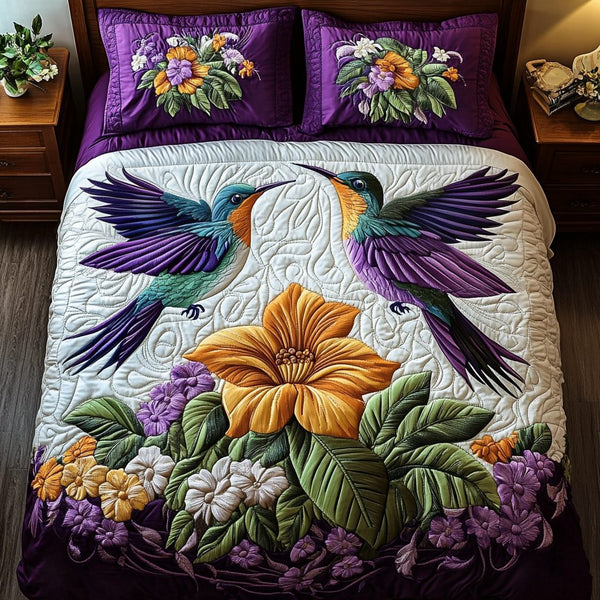 Bloom Harmony quilted 3-piece bedding set on a made bed with two matching pillow shams