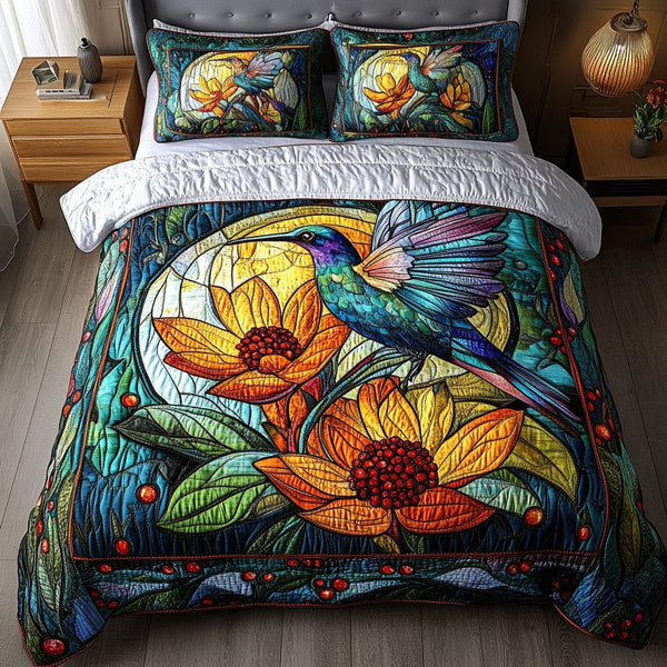 Bloom Seeker quilted 3-piece bedding set on a made bed with two matching pillow shams