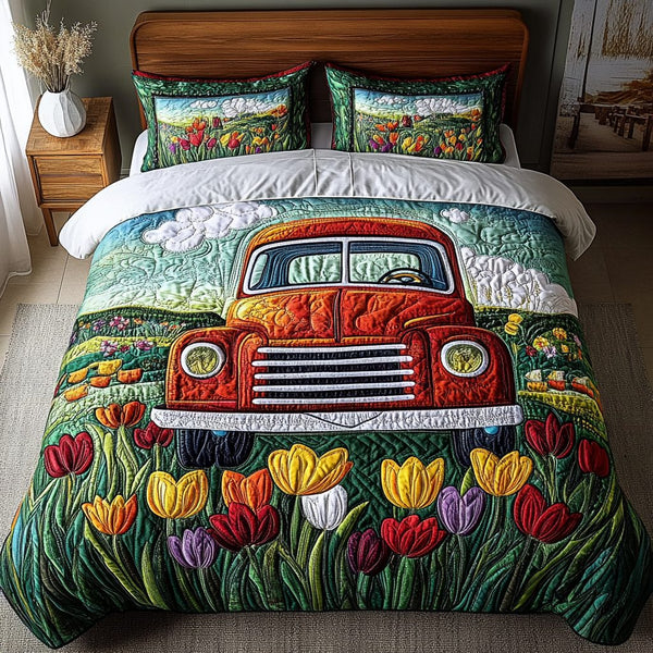 Bloom Truck quilted 3-piece bedding set on a made bed with two matching pillow shams