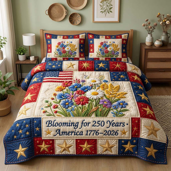 Blooming America quilted 3-piece bedding set on a made bed in a warmly lit bedroom