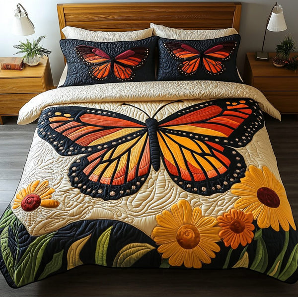 Blooming Butterfly quilted 3-piece bedding set on a made bed with two matching pillow shams