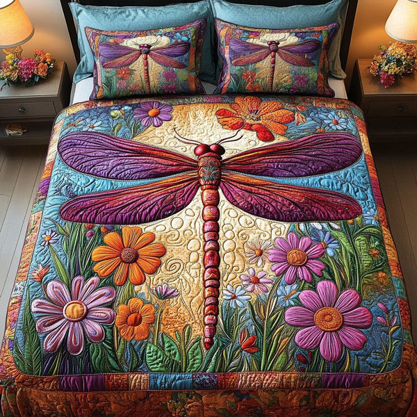 Blooming Dragonfly quilted 3-piece bedding set on a made bed with two matching pillow shams