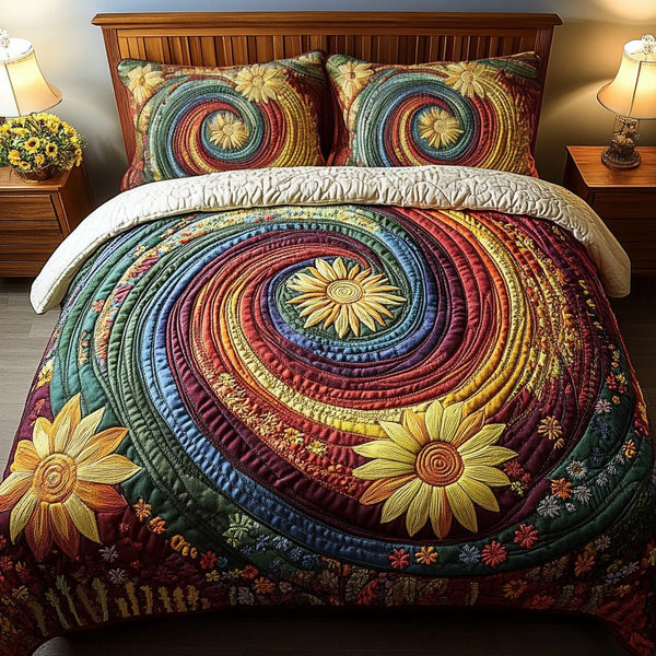 Blooming Dreams quilted 3-piece bedding set on a made bed with two matching pillow shams