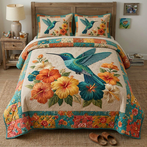 Blooming Garden quilted 3-piece bedding set on a made bed with two matching pillow shams
