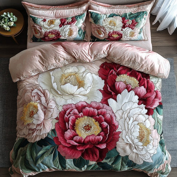 Blooming Grace quilted 3-piece bedding set on a made bed with two matching pillow shams
