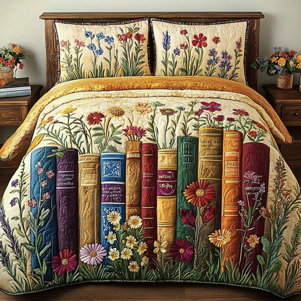 Blooming Library quilted 3-piece bedding set on a made bed with two matching pillow shams