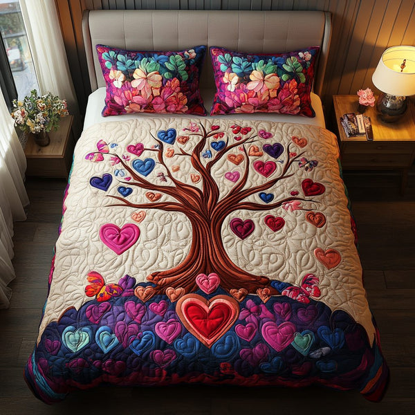Blooming Love quilted 3-piece bedding set on a made bed with two matching pillow shams
