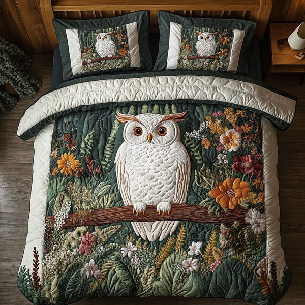 Blooming Owl quilted 3-piece bedding set on a made bed with two matching pillow shams