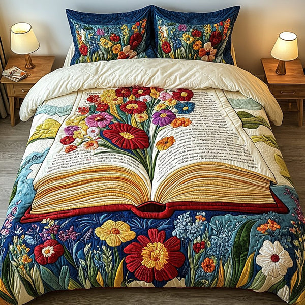 Blooming Pages quilted 3-piece bedding set on a made bed with two matching pillow shams