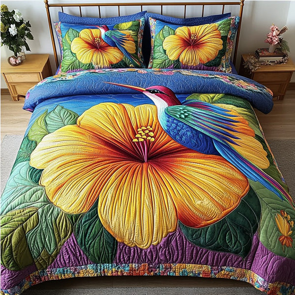 Blooming Spirit quilted 3-piece bedding set on a made bed with two matching pillow shams