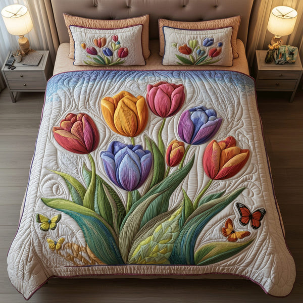 Blooming Tulip quilted 3-piece bedding set on a made bed with two matching pillow shams