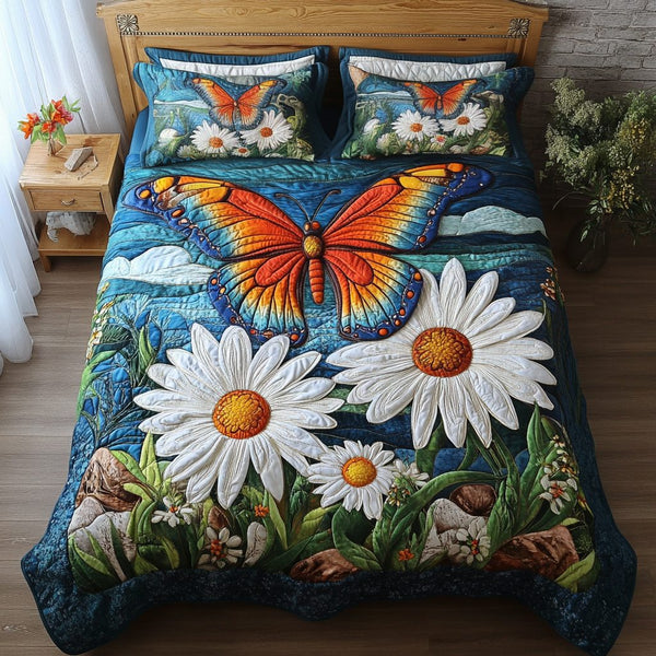 Blooming Wings quilted 3-piece bedding set on a made bed with two matching pillow shams