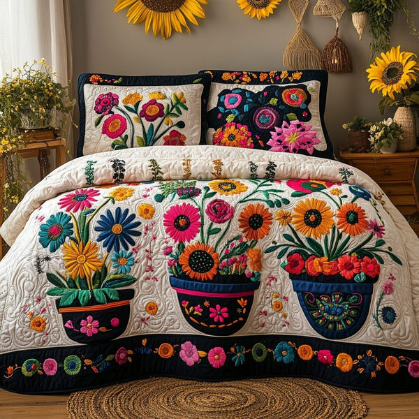Blossom Breeze quilted 3-piece bedding set on a made bed with two matching pillow shams