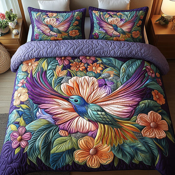 Blossom Flight quilted 3-piece bedding set on a made bed with two matching pillow shams
