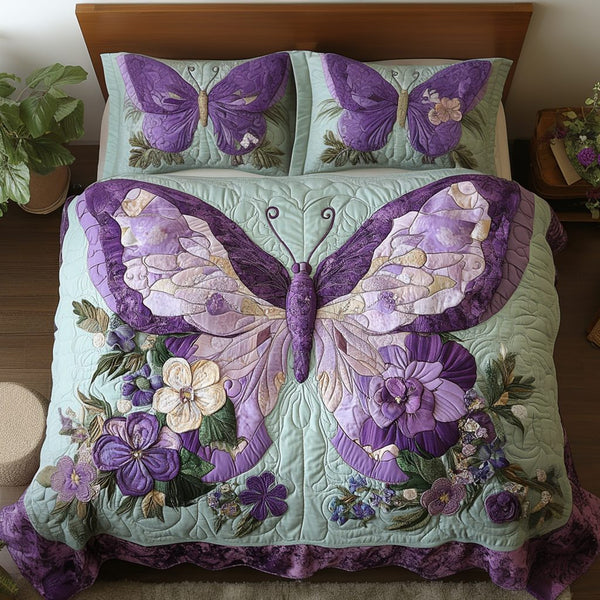 Blossom Flight quilted 3-piece bedding set on a made bed with two matching pillow shams