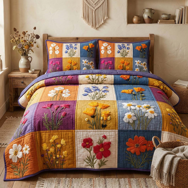 Blossom Grace quilted 3-piece bedding set on a made bed with two matching pillow shams