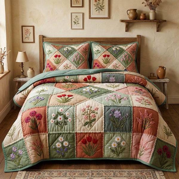 Blossom Grace quilted 3-piece bedding set on a made bed with two matching pillow shams