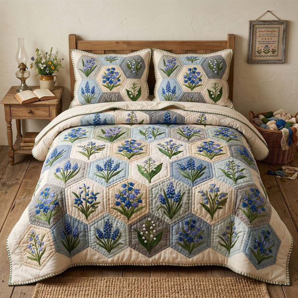Blossom Grace quilted 3-piece bedding set on a made bed with two matching pillow shams