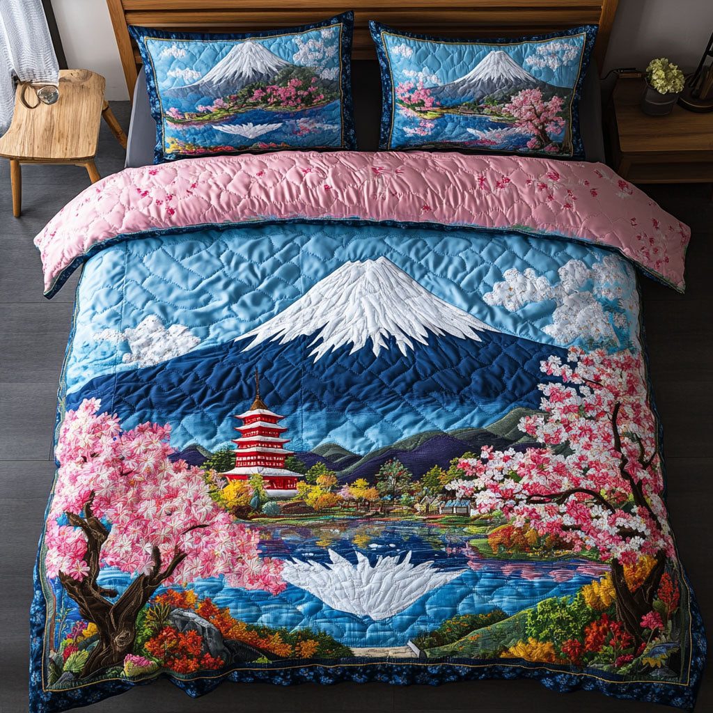 Blossom Haven quilted 3-piece bedding set on a made bed with two matching pillow shams