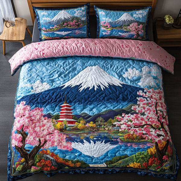 Blossom Haven quilted 3-piece bedding set on a made bed with two matching pillow shams