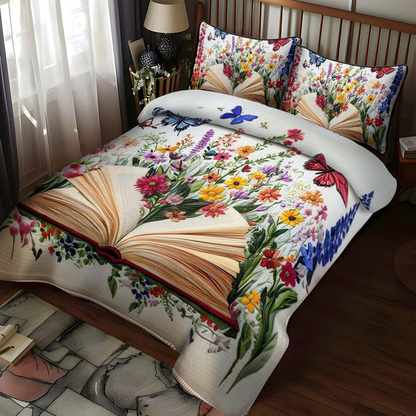 Blossom Of Knowledge quilted 3-piece bedding set on a made bed with two matching pillow shams