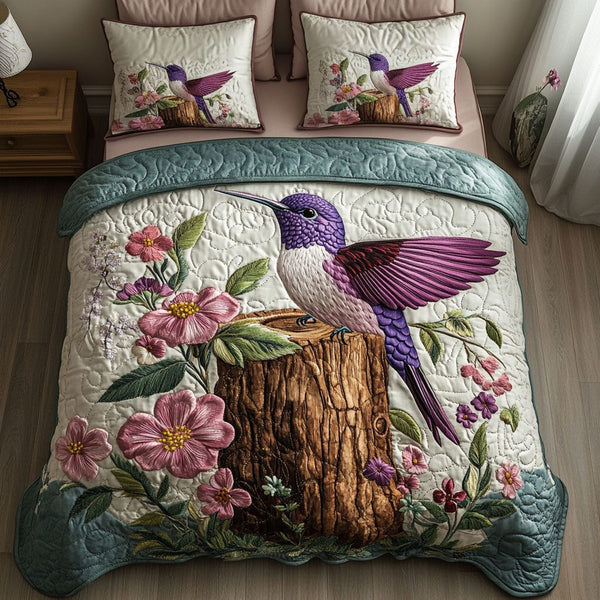 Blossom Perch quilted 3-piece bedding set on a made bed with two matching pillow shams
