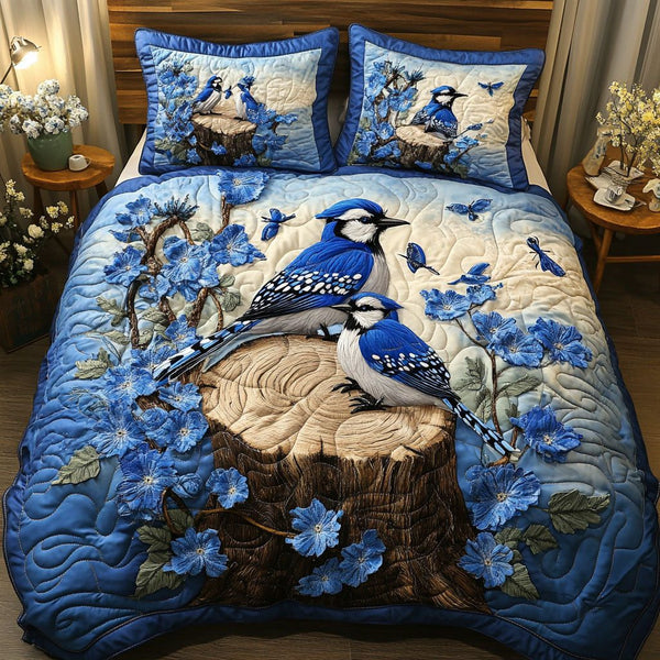 Blossom Serenity quilted 3-piece bedding set on a made bed with two matching pillow shams